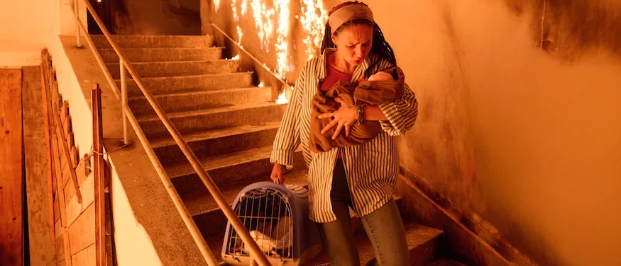 A woman carrying her baby needs a property crimes lawyer after accidentally setting a fire.