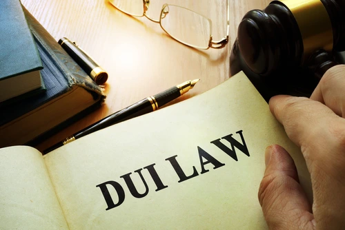 A Nashville DUI defense lawyer reads a DUI law books.