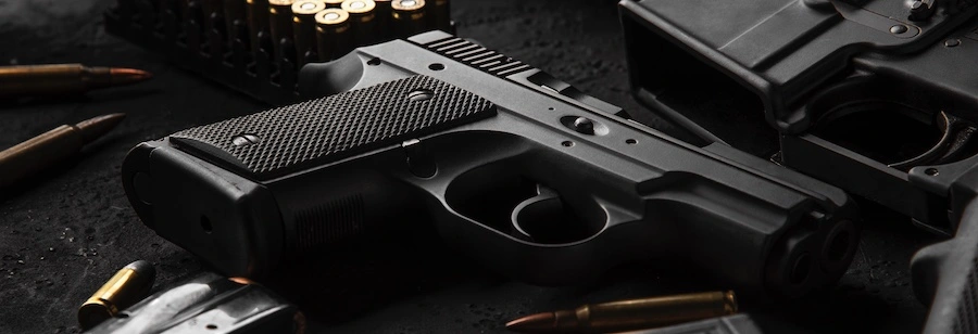 A gun and ammunition represent a Nashville gun crimes lawyer.