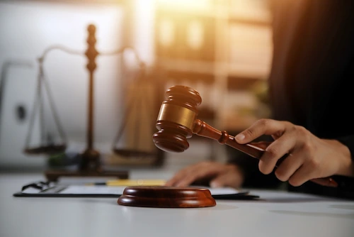 A judge reads charges during the first court appearance in a Nashville criminal case.